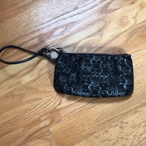 Black and silver Coach wristlet